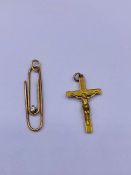 Two 9ct gold pendants a cross and a paperclip. 2.3g