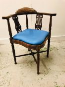 A Edwardian corner chair with blue seat pad.