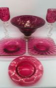 A selection of cranberry glass to include 4 square gold rimmed plater, 2 goblets, a large fruit bowl