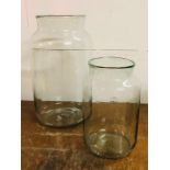 Two large glass jars by Mica decorations standing 43cm H and 30cm H