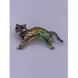 A silver and plique a jour brooch in the form of a cat