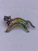 A silver and plique a jour brooch in the form of a cat