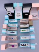 Eighteen boxed Fashion silver rings.