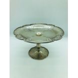 A Silver cake stand with pierced floral design, hallmarked London 1924 (CCP Makers MArk)