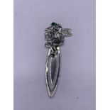 A silver bookmark with fairy finial set with emerald cabochon in the art nouveau style