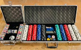 Two sets of Poker chips in metal cases