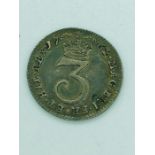 A 1762 George III threepence coin
