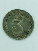 A 1762 George III threepence coin