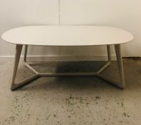 A Large pale grey oval dining table in a contemporary style 200cm W x 100cm D x 76cm H