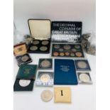 A selection of coins including Crowns, UK and Overseas, along with collectors packs