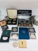 A selection of coins including Crowns, UK and Overseas, along with collectors packs