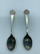 A pair of hallmarked silver teaspoons hallmarked year 2000.