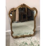 Gilt mirror with scrolled detail