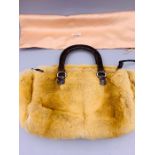 A Vintage Prada Crocodile and Fur hand bag, with original dust cover.