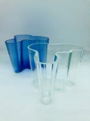 Pair of Alvar Arto Hankie vases, one blue and one clear both 12cms tall