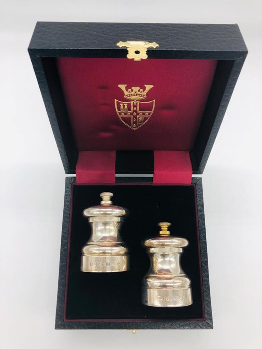 A cased set of silver, hallmarked Birmingham 2000, makers mark WW, salt and pepper grinders.