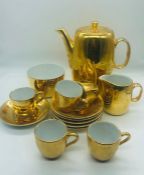 A Royal Worcester Coffee pot, sugar bowl and milk jug along with five coffee cups and six saucers