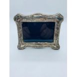 A silver easel back picture frame