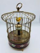 A brass cased singing bird clock