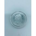 A silver proof boxed five pound coin