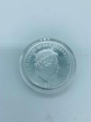 A silver proof boxed five pound coin