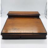 A small portable writing box or slope with inkwell
