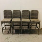 Four grey rattan bar chairs with chrome feet.