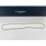 A Freshwater pearl necklace on a 9ct gold setting
