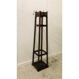 A Tall Coat stand in the Arts and Crafts style H 187cm.