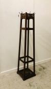 A Tall Coat stand in the Arts and Crafts style H 187cm.
