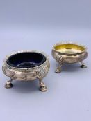 A Pair of silver cruets one with a blue glass liner. Makers Mark WC hallmarked London 1896.