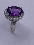 A silver CZ and large amethyst dress ring