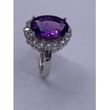 A silver CZ and large amethyst dress ring