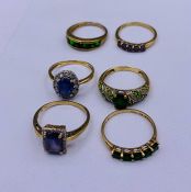 A selection of six 9ct gold rings with various settings