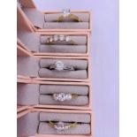A selection of five boxed 9ct gold rings with various settings