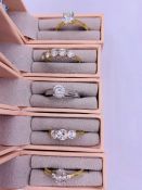 A selection of five boxed 9ct gold rings with various settings