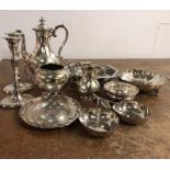A large selection of silver plated items to include candlestick, coffee service and serving dishes.