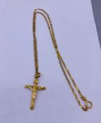 A 9ct gold crucifix on chain (3.1g)