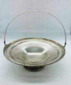 A Silver cake stand with handle, with a pierced design, marked 925 360g