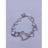 A silver and CZ heart shaped linked bracelet