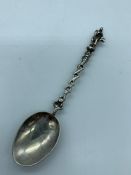 A single silver Apostle spoon.