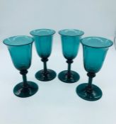 A set of Four dark green wine glasses C1770