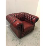 A Chesterfield style Ox Blood Club chair
