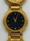 A Classic Gianni Versace Medusa coin watch in original box