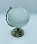 A glass desk globe