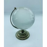 A glass desk globe