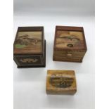 Three assorted wooden items to include cigarette boxes.