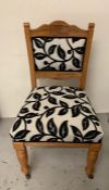 Six Oak craved back dining chairs with black and white seat covers
