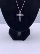 A silver and CZ crucifix on silver chain