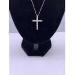 A silver and CZ crucifix on silver chain